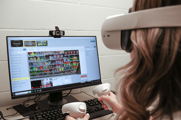 Research participant engaging in virtual reality research in front of computer Research participant engaging in virtual reality research in front of computer