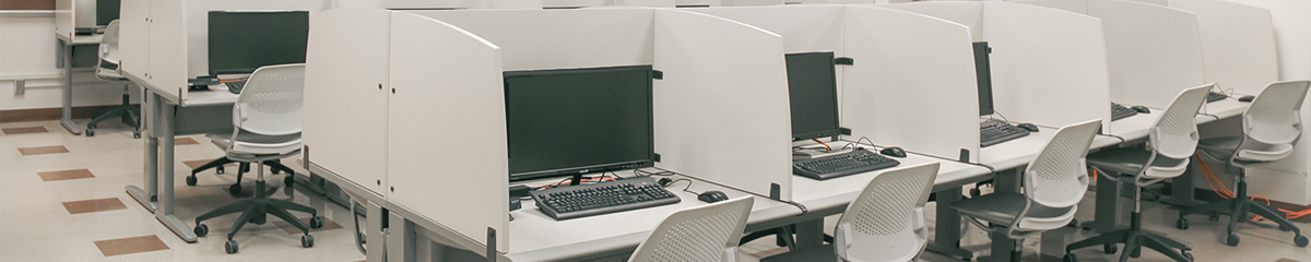Computer terminals sitting empty in the business research lab